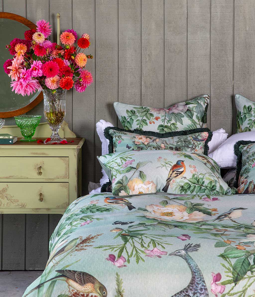 Chinoiserie Duvet Set depicts ornate flora and fauna in an original panel design washed with a celedon green backgound.