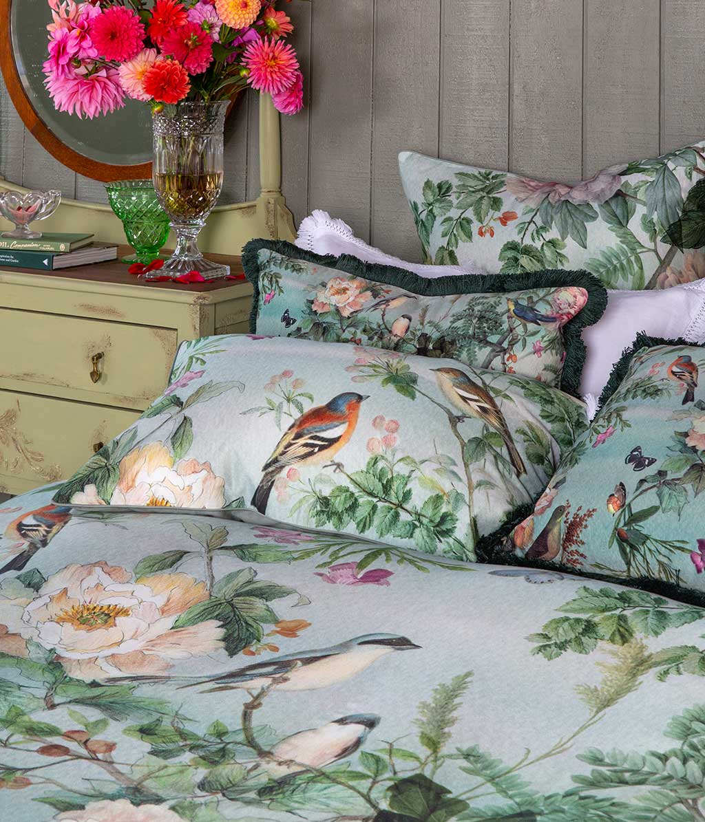 Chinoiserie Duvet Set depicts ornate flora and fauna in an original panel design washed with a celedon green backgound.