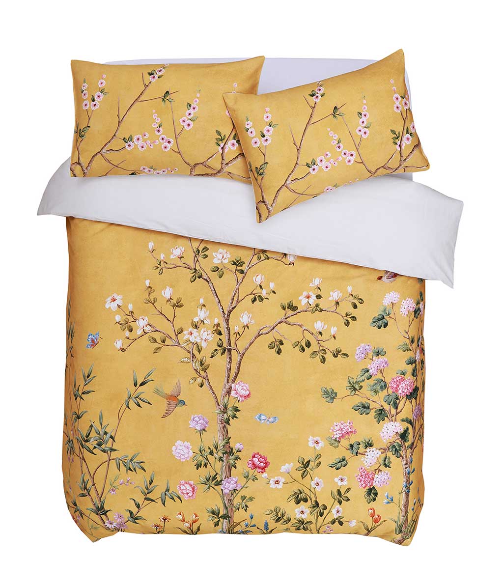 Opulent and artistic, M.M Linen Yuki design of charming blossoms and fauna on a sunny and soft, golden background